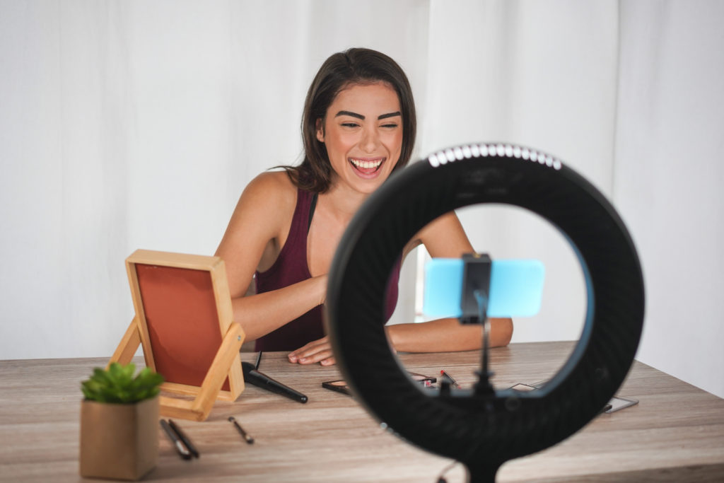 Young business owner creating videos