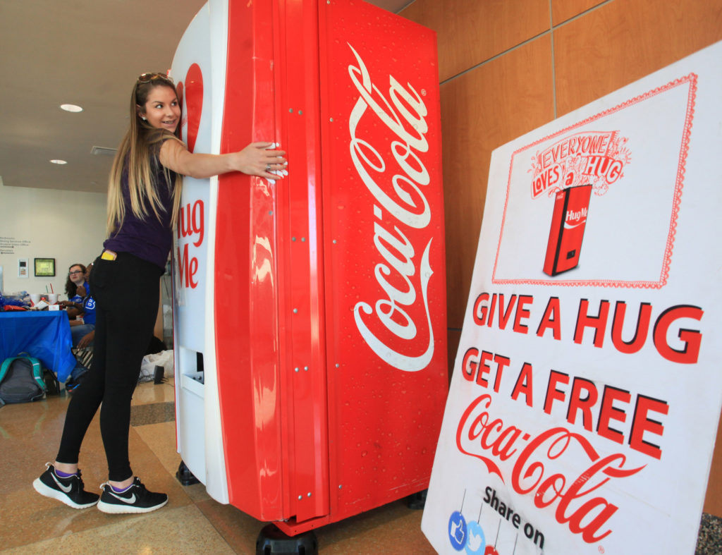 Deliver Experiences | Hug Me | CocaCola | 10 Customer Retention Strategies from Top Brands